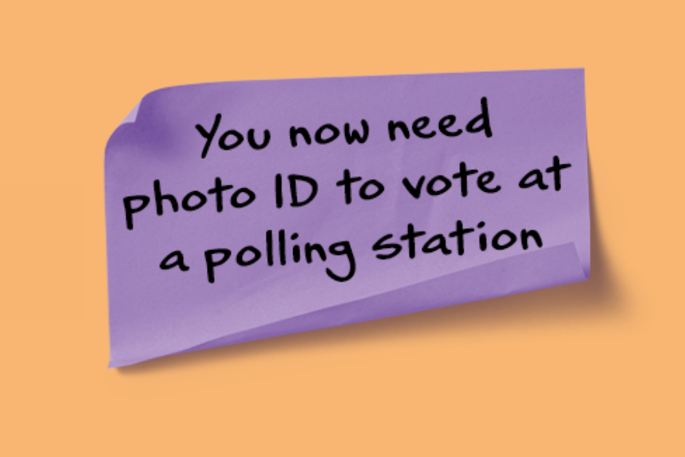 Image of a purple post it note featuring the text: You now need photo ID to vote at a polling station