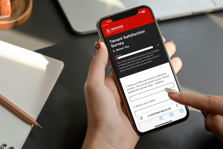 Female completing the tenant satisfaction survey on a smartphone