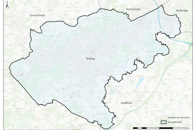 Map showing the boundary of Woking Borough highlighted over an Ordnance Survey base map. The shaded area covers Woking and surrounding settlements including Knaphill, Horsell, Byfleet and West Byfleet. Neighbouring local authority areas are labelled, including Surrey Heath to the northwest, Runnymede to the north, Elmbridge to the northeast and Guildford to the south. A north arrow and scale bar are included.