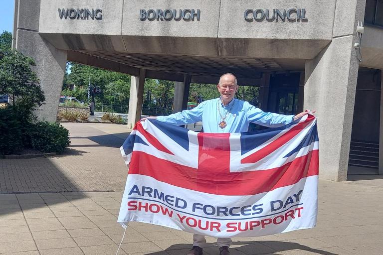 Mayor of Woking, Cllr Rob Leach, with Armed Forces Day flag
