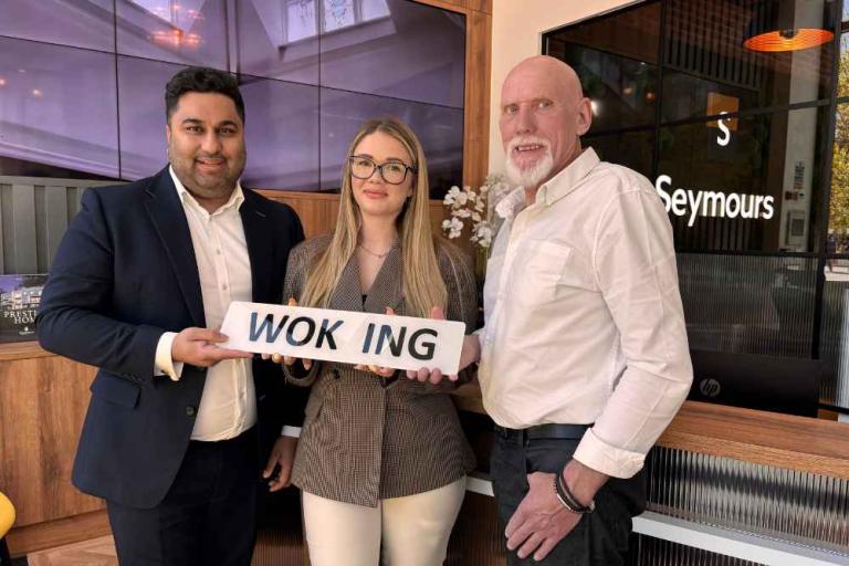 Zo Khan and Sophie Christmas from Seymours with Terry Fox, the organiser of the Woking Car Show.