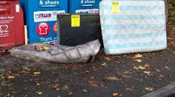 Fly-tipped waste at Parley Drive charity bring site