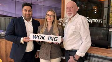 Zo Khan and Sophie Christmas from Seymours with Terry Fox, the organiser of the Woking Car Show.